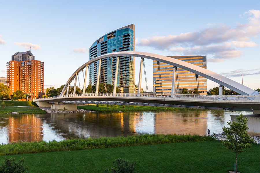 Contact - View Of City Buildings And Bridge Over River In Columbus Ohio